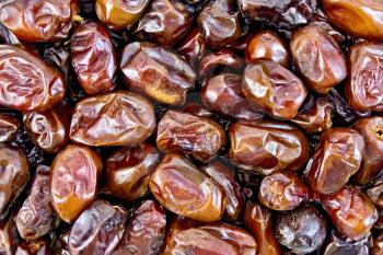 Texture of brown dried fruit of the date palm