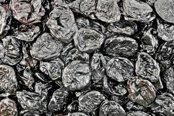 The texture of a black dried prunes