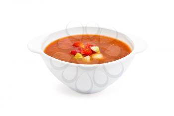 Gazpacho tomato soup in a white bowl isolated on white background
