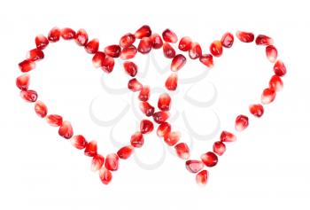 Royalty Free Photo of Pomegranate Berries Forming Two Hearts