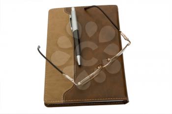 Royalty Free Photo of Glasses and a Pen on a Folder
