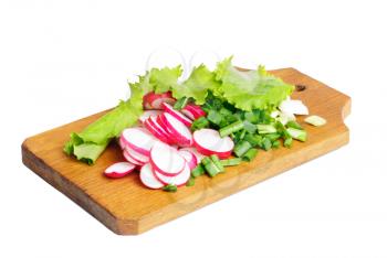 Fresh slised radish, onion and salad on cutting board isolated on white 