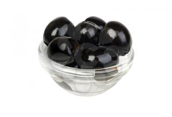 Black pitted olives in glass isolated on white macro 