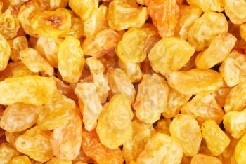 Golden raisins close- up food background
