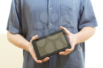 Royalty Free Photo of a Person Holding a Tablet
