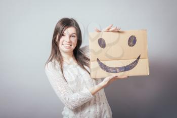 girl holding a happy smiley