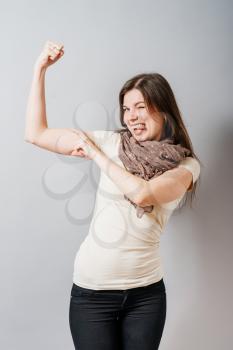girl shows biceps