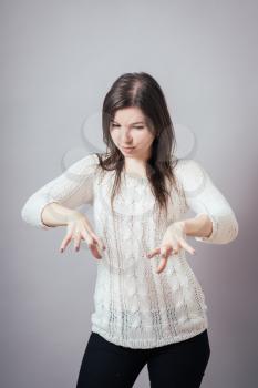 girl holds something invisible