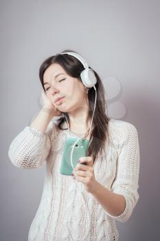 Girl listening to music from your phone