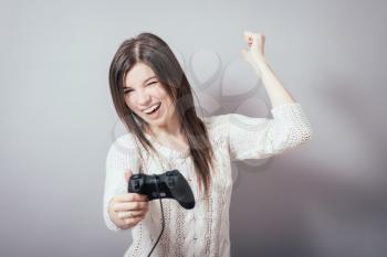 picture of happy woman with joystick playing video games