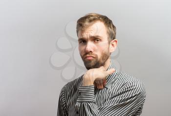 portrait of an offense man over a gray background