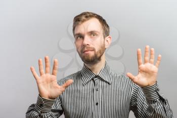 The man did not beat hands  isolated on the gray background
