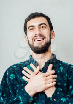 Handsome caucasian male resting hands on his chest