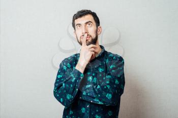 young bearded man intelligence and think gesture