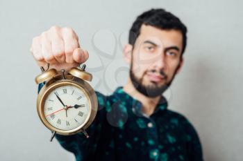 Man holding a clock 