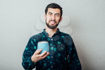 Handsome guy with cup of tea