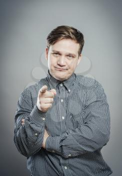 young  man pointing at someone gesture with finger