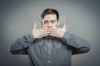 Man covering his mouth