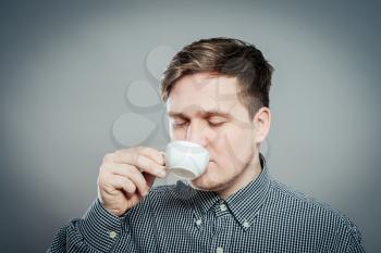 image of adult man resting with coffee mug