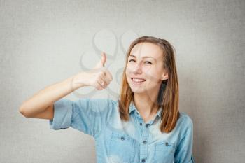 female gesture thumb up. isolated on gray background