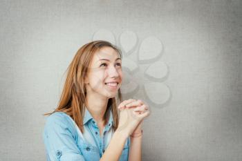 female gesture prayer, conversation with God. isolated on gray background