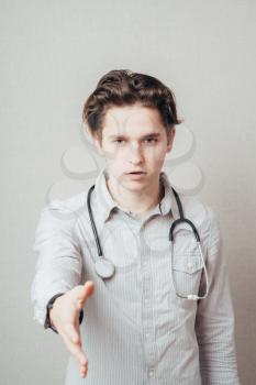Young male doctor with stethoscope