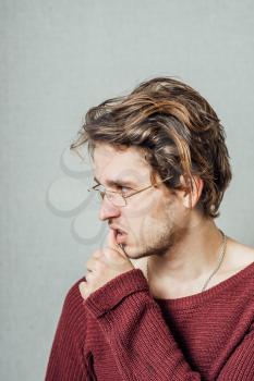 young business man biting his nails . on a light gray studio background