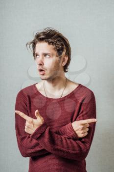 The man  shows in different directions. On a gray background.