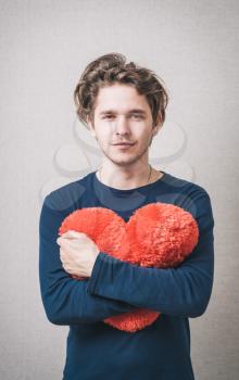 Love and valentines day man holding heart