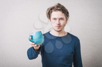 man holding a cup