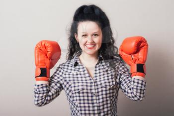 businesswoman with boxing gloves ready for fighting