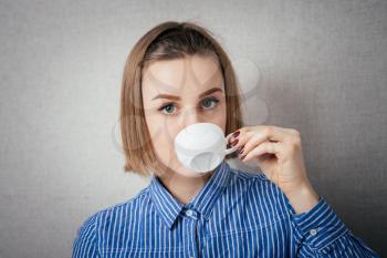 woman drinking coffee cup close up portrait