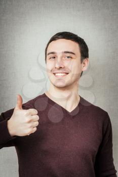 man showing thumbs up and smiling