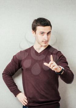 young  man, pointing at someone gesture with finger