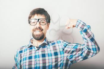 Funny man pointing to his biceps