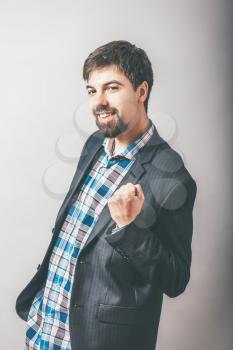 bearded businessman happy with fist