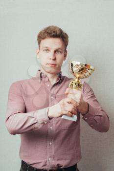 a man with a prize trophy