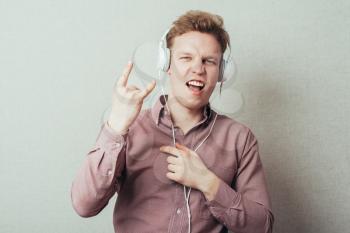 man with headphones shows rock