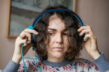 girl wears headphones