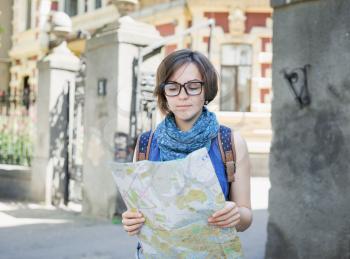 young girl tourist with map in hand