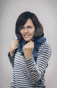 Young woman showing fists