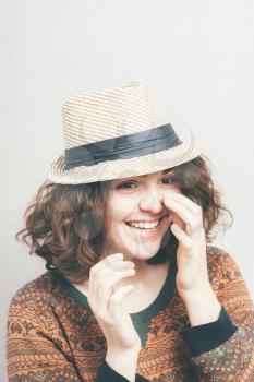 girl with a hat laughing