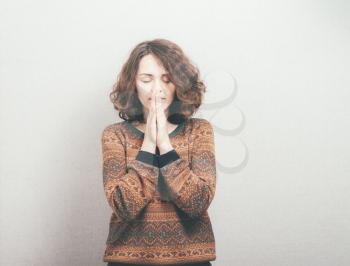beautiful young girl prays