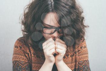 praying girl in glasses