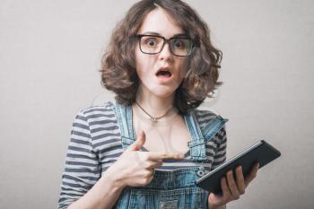 young woman shows tablet