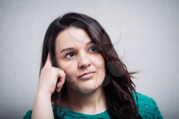 Worried woman tries to remember something