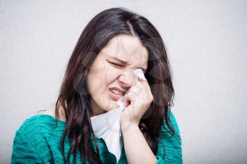 girl crying into a handkerchief