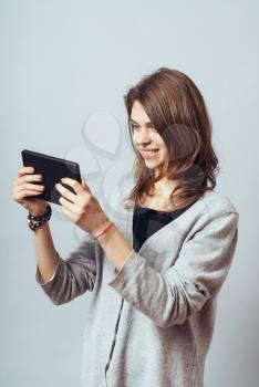 young woman using digital tablet computer