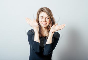 young casual woman with a smile on her face and her arms wide open
