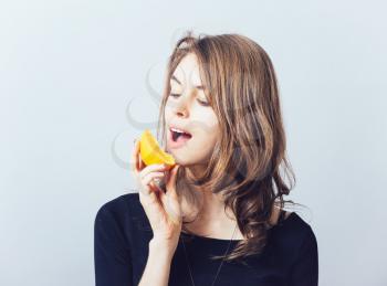 young beautiful woman with citrus orange fruit having fun. 